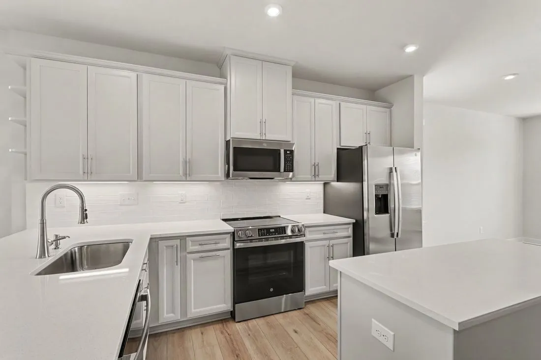 Kitchen with white cabinets and stainless steel appliances